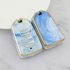 Isuzu Autoschlüsseletui, goldfarben mit Jade-Einlage